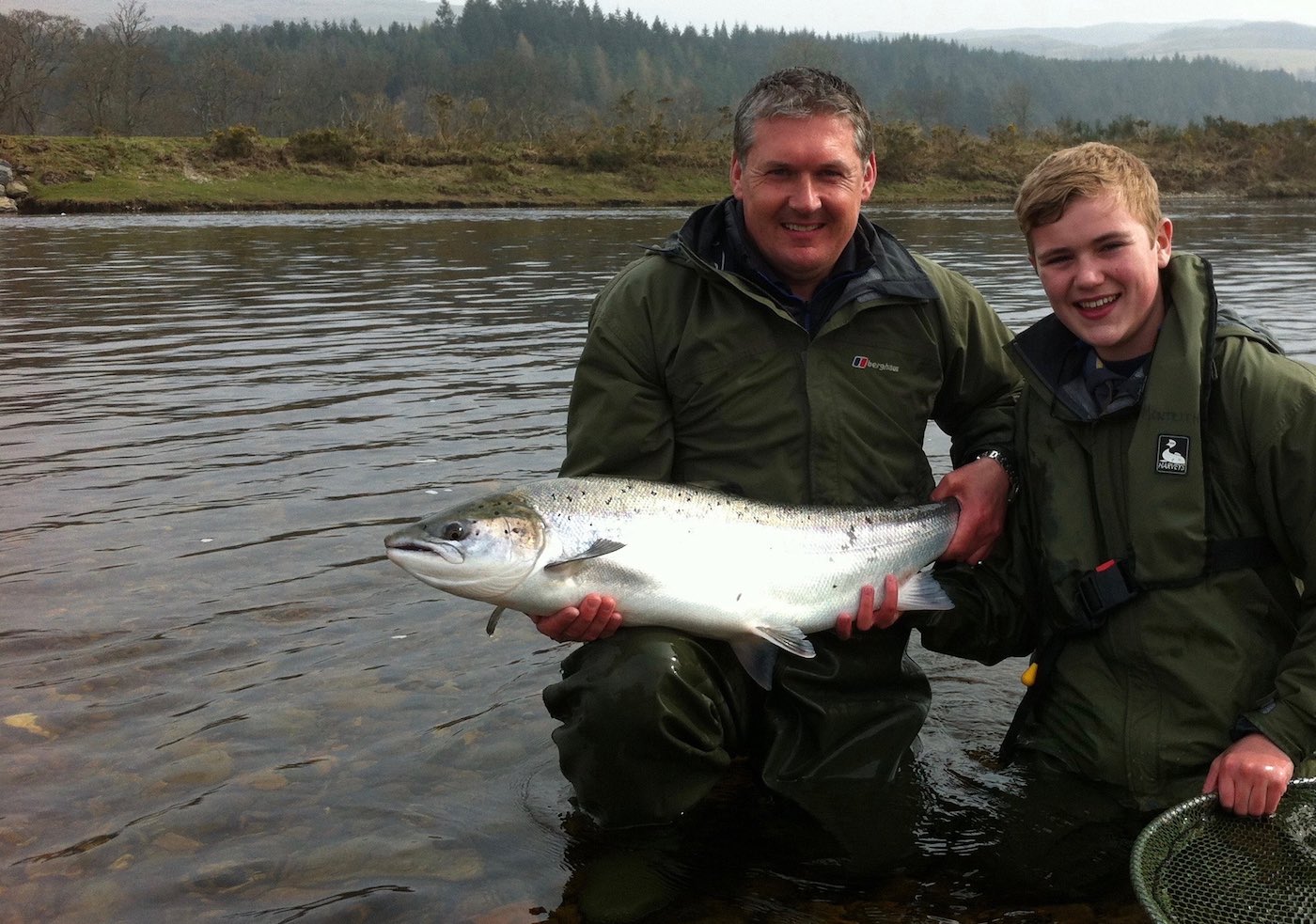 Here's professional River Tay salmon guide Jock Monteith with a brand new salmon fishing trip guest  holding a heavyweight Spring salmon which was caught on the River Tay. This was the first of 2 heavyweight salmon caught by this young salmon fisher that morning,.