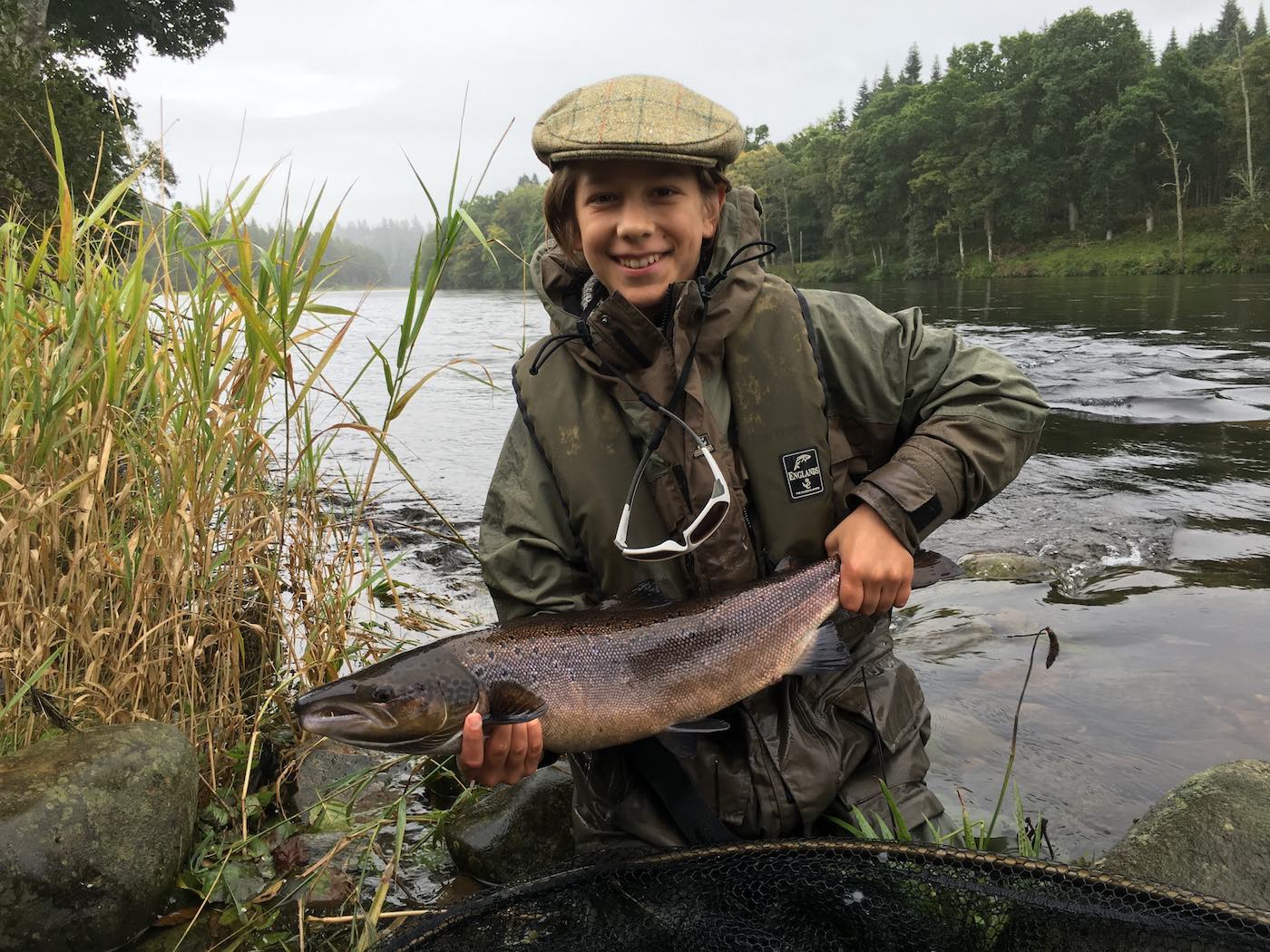 This young salmon fly fisherman caught this Autumn run salmon at the Willie's Croy salmon Pool at the bottom end of the Newtyle Beat near Dunkeld while I was his personal salmon fishing guide. This was this young Austrian salmon fisher's first ever salmon which he caught all by himself with a perfect Spey casting technique which he picked up very quickly. Note he is wearing a life jacket and safety glasses which are essential fly fishing safety equipment items.