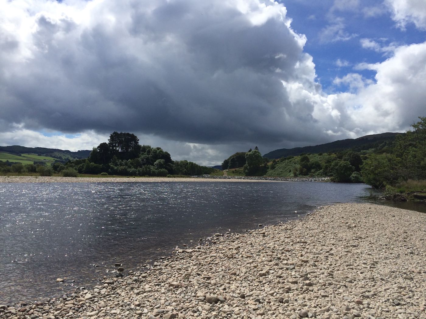 This is the old tail of the Ash Tree Pool on the Kinnaird salmon beat before the river re-diverted itself a few years ago and this entire run disappeared and re-routed itself way off to the left of frame. This pool at the end of the gravel riverbank was called New Pool and where the river turns left in the distance was known as Fir Trees Pool. The salmon rivers often re-route themselves like this requiring our salmon fishing instructors to re-learn them from time to time.