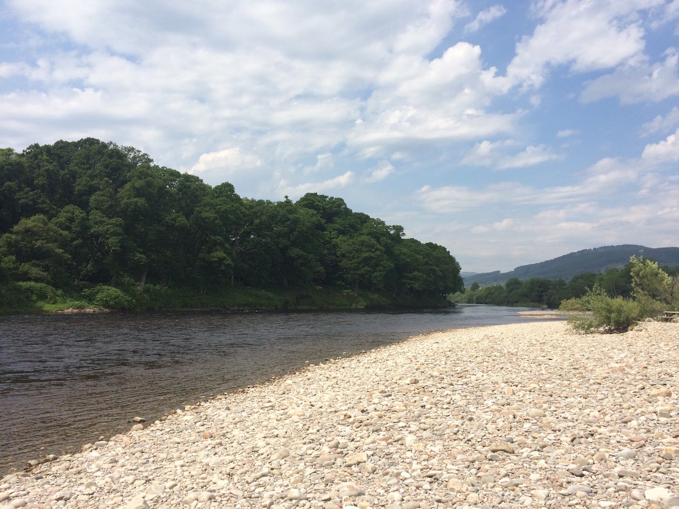 This is the gravel riverbank at the Meetings Pool on the River Tay where the River Tummel meets the Tay near the Perthshire town of Pitlochry. This type of salmon pool is every professional salmon guides dream to fish through due to this gently tapered riverbank terrain.