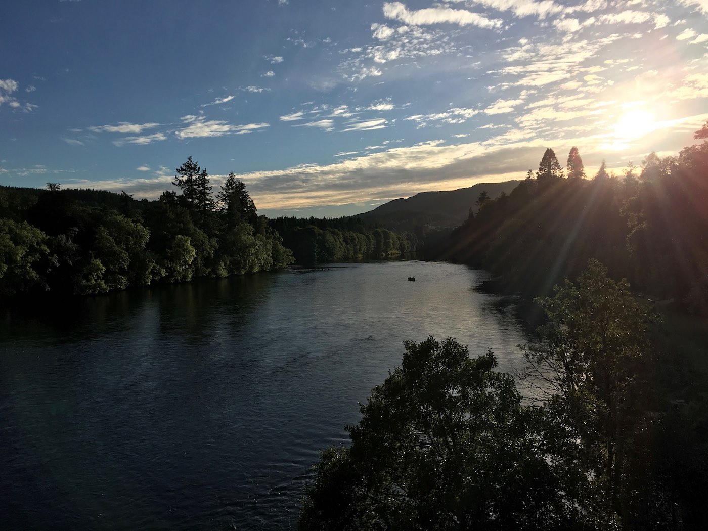 This upstream dusk shot of the Cathedral Stream was taken from the middle section of the Telford Bridge in Dunkeld. You can see the salmon fishing guide with his fishing guest still out in the boat as the light is starting to fade in pursuit of an evening salmon.