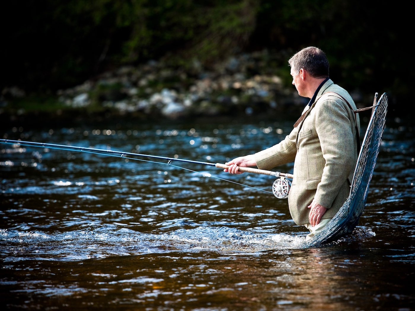 This shot was taken by professional photographer Louise Bellin on the River Tay's Meetings Pool on the Kinnaird Beat while I was serving as the Upper Kinnaird Beat Head Ghillie. My landing net is over my shoulder in anticipation of a pluck on the salmon fly which often occurs in this perfect salmon pool.