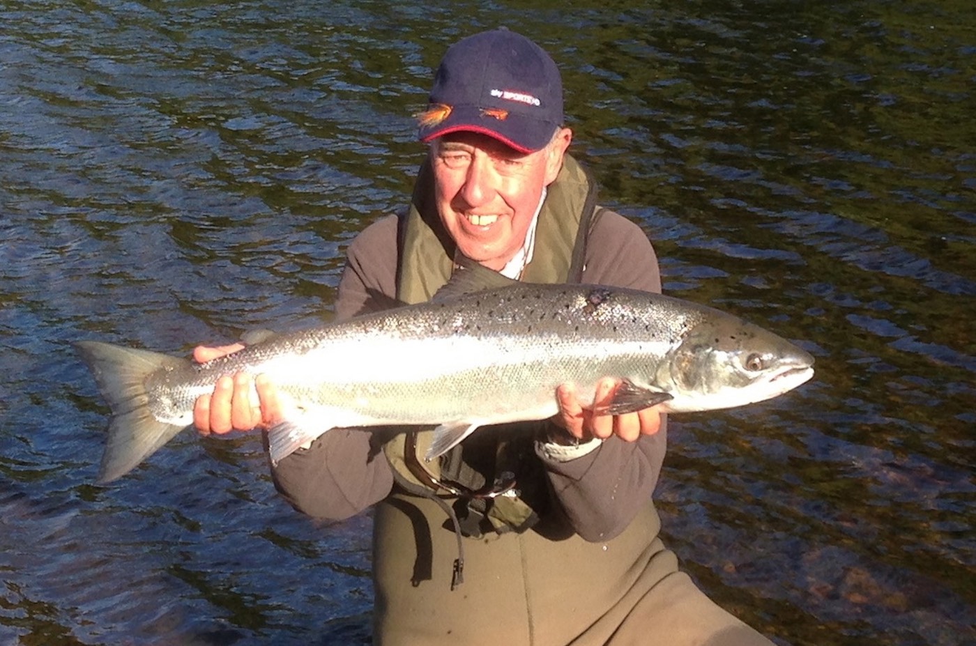 Keith had been trying to catch a salmon for a number of years before he was pointed to myself on the River Tay for his Sky TV Tight Lines programme. It took all of 10 minutes to put him into this fine River Tay salmon as his personal salmon fishing guide at the Boat Pool on the Glendelvine Beat. The Sky Sports cameras captured all of the footage and everyone went home happy and even the fish too which was released after this fine photo was taken. Note Keith is wearing a life jacket with his chest waders which is essential for safe wading reasons.