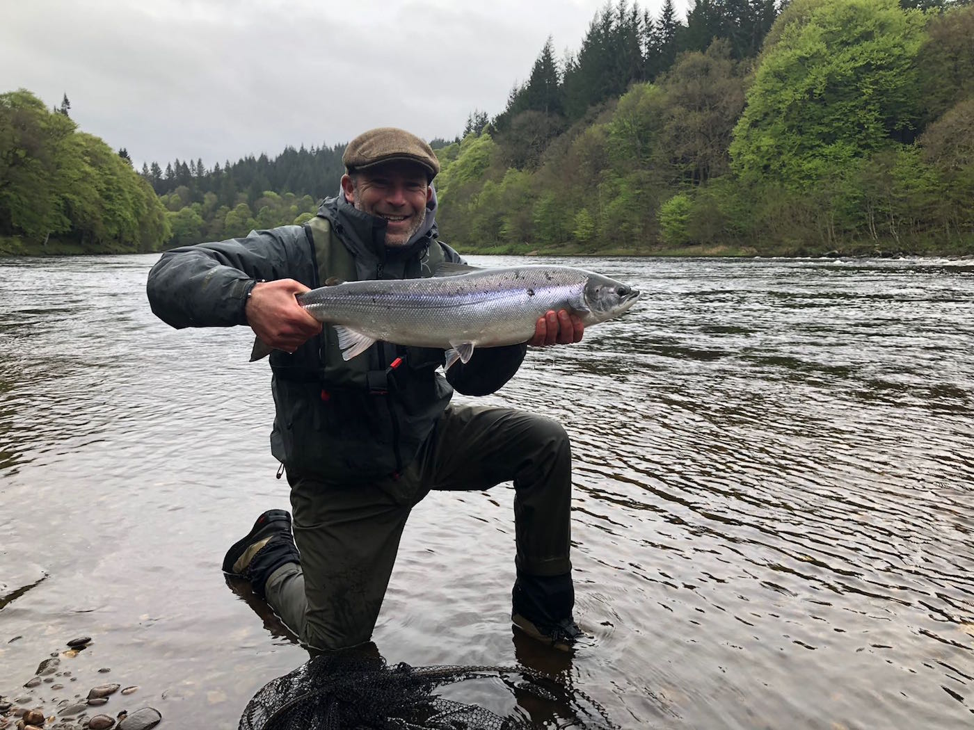 Here's a fine Spring salmon which was landed by this happy salmon angler after a full day of searching. This salmon was landed during May at Dunkeld which is a popular Spring salmon fishing area of the River Tay in Perthshire. You can see the new leaves that have appeared on the riverbank trees behind this fisherman.