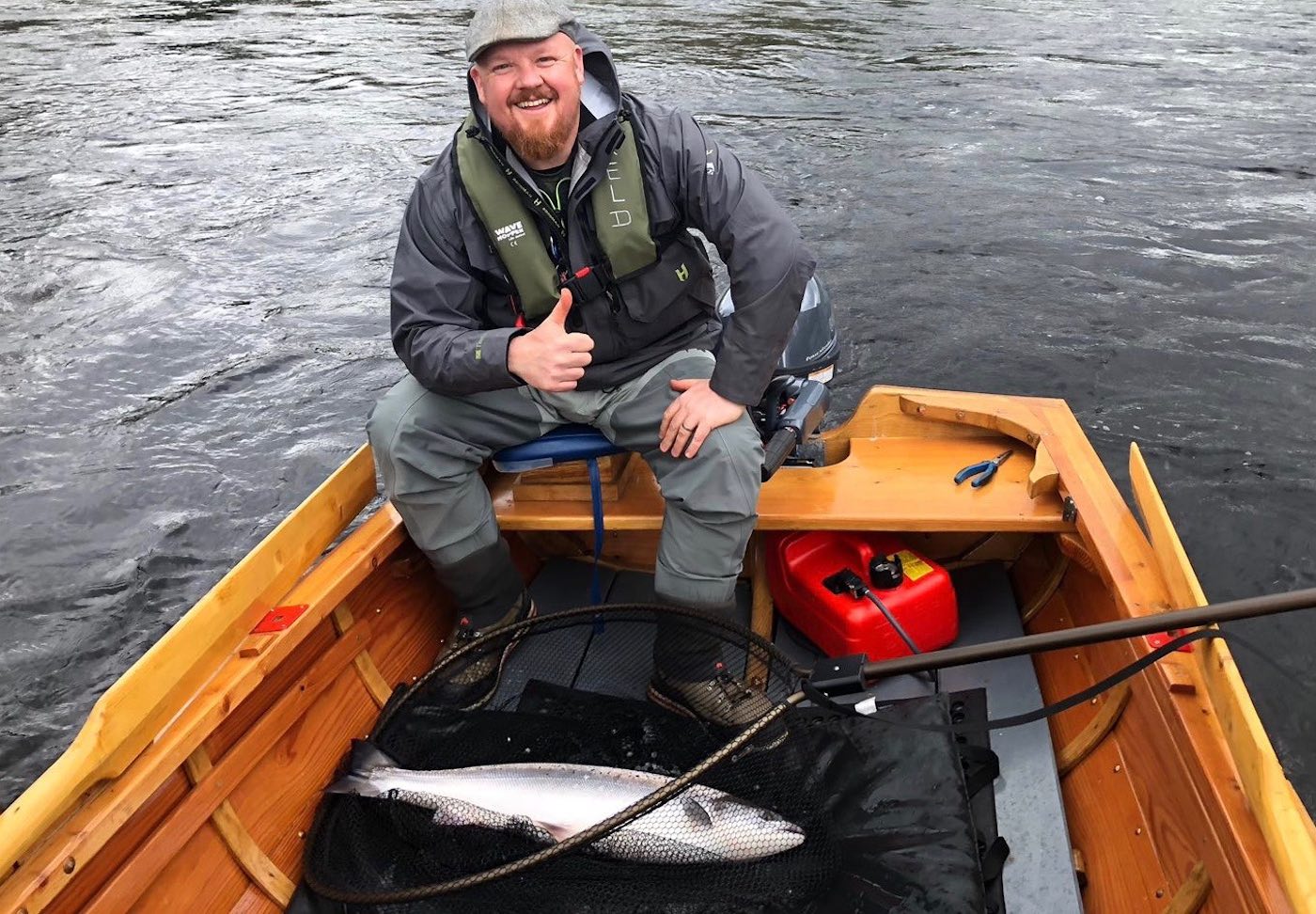 The traditional River Tay salmon fishing boats are exceptionally productive during the higher water levels of early Spring as this fortunate salmon fisher found out at Dunkeld. The boat allows for a slower salmon lure to be fished which is a great cold water presentation tactic which resulted in the capture of this heavyweight salmon. You can see the salmon in the landing net prior to being released back to the river.