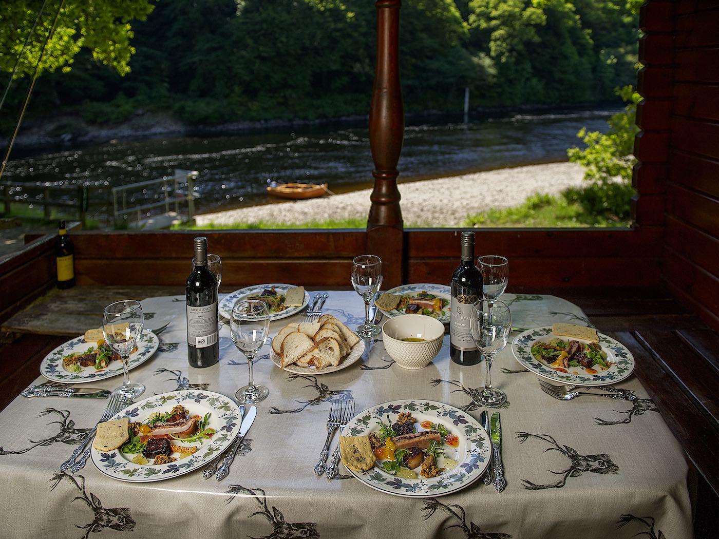 Here's a perfectly presented luncheon scene from the River Tay at Dunkeld. On corporate salmon fishing event days or when bigger salmon fishing guide parties have booked a salmon beat exclusively bringing a professional chef in to take care of the lunch proceedings is a fantastic thing to do. You can see the traditional River Tay salmon fishing boat in the background.