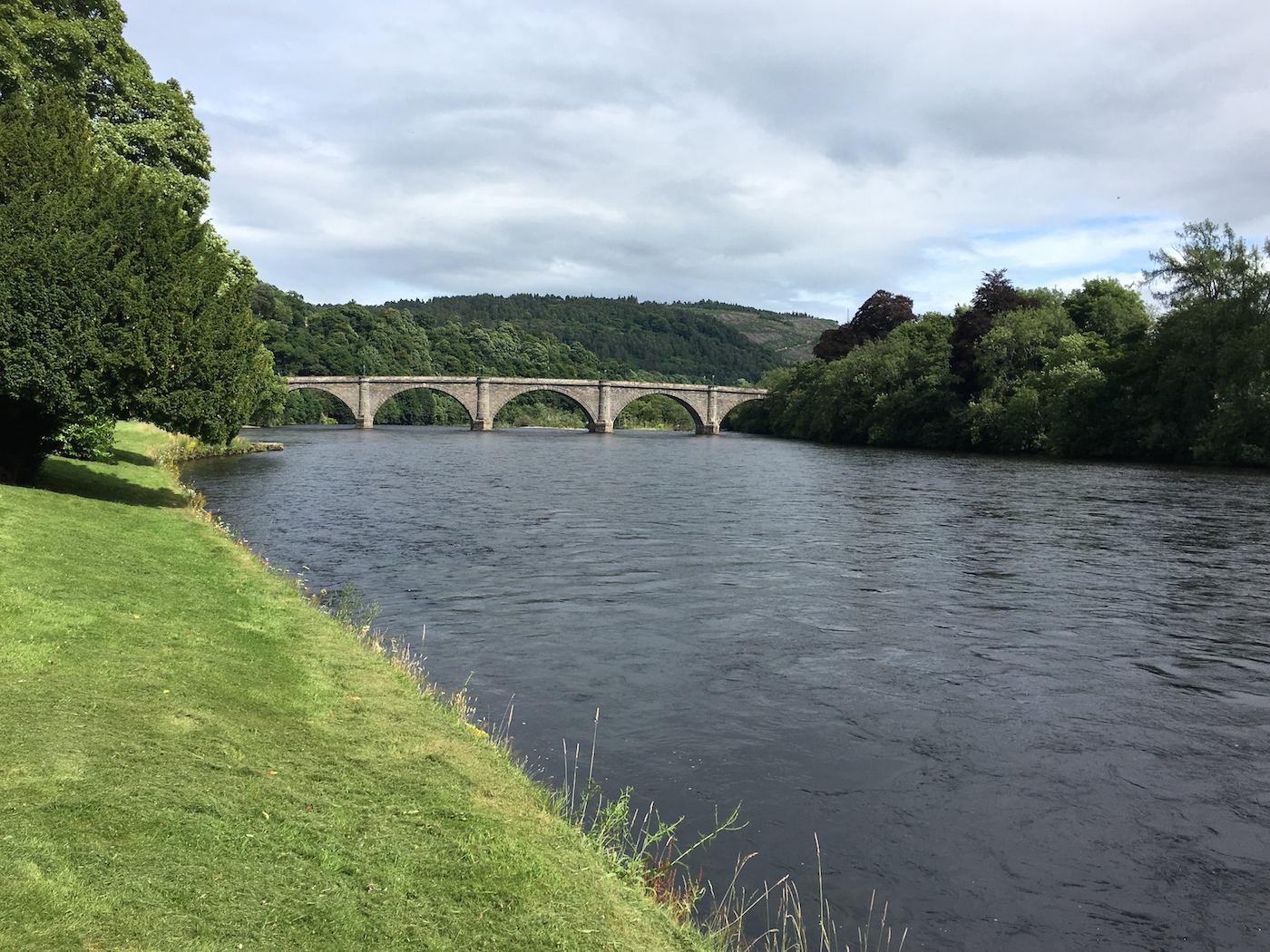 This is the Cathedral Pool on the River Tay in Dunkeld which is a great salmon fishing proposition for visiting salmon fishing holiday visitors. When salmon run up through the fast water underneath the downstream sandstone Telford Bridge they stop right here in front of the camera for a rest where they can be fairly easily caught.