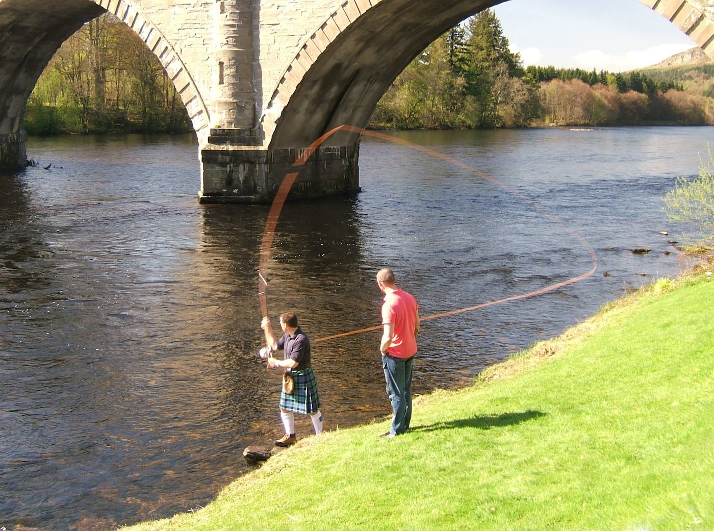 Here's Jock Monteith amidst a Spey casting lesson on the River Tay under the historic Telford Bridge demonstrating perfect D Loop loading with the single Spey cast. The traditional Spey cast is the most effective and satisfying casts. This photo was taken by local Dunkeld photographer Charlie MacDonald. Jock is wearing his Graham of Menteith tartan kilt while demonstrating Spey cast with his 15ft Monteith salmon fly rod.