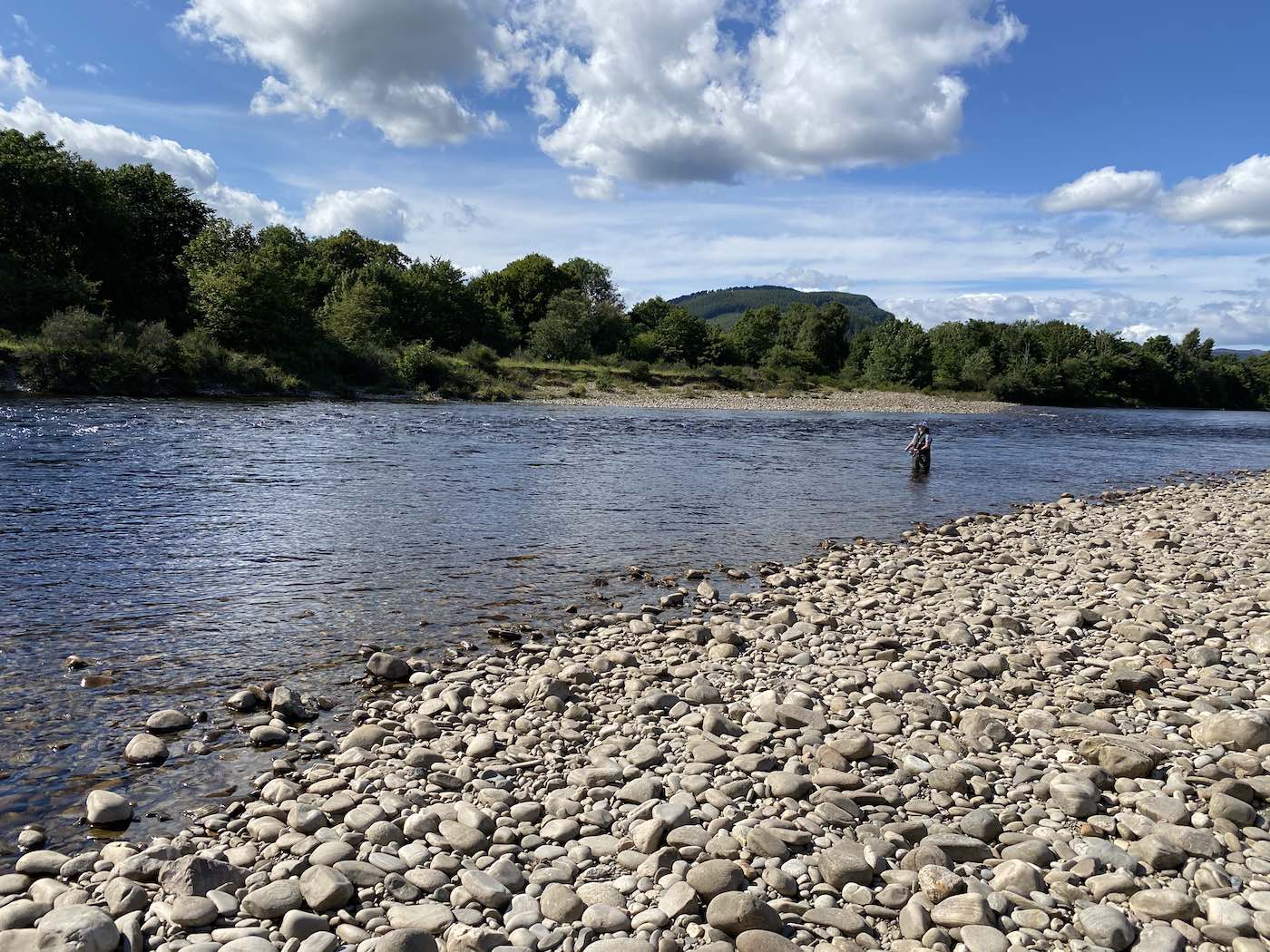 This salmon fisher had just been taught how to use a double handed salmon fly rod and had just started to fly fish unassisted in his chest waders when I took this shot on the Mike's Run Pool of the River Tummel.