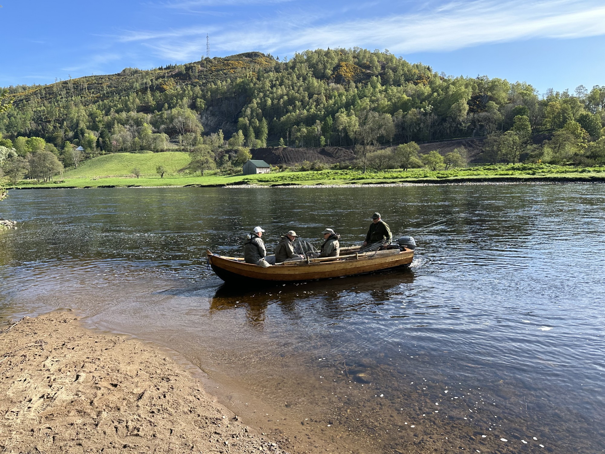 I took this shot of a boat load of visiting salmon fishers being brought back over to the fishing hut for their lunch on the River Tay near Birnam. The boats on this beat have been kept on this sandy riverbank for over 60 years. You can see the boathouse on the far riverbank which I built in 2007 while I was working on this Tay salmon beat as the Head Ghillie.