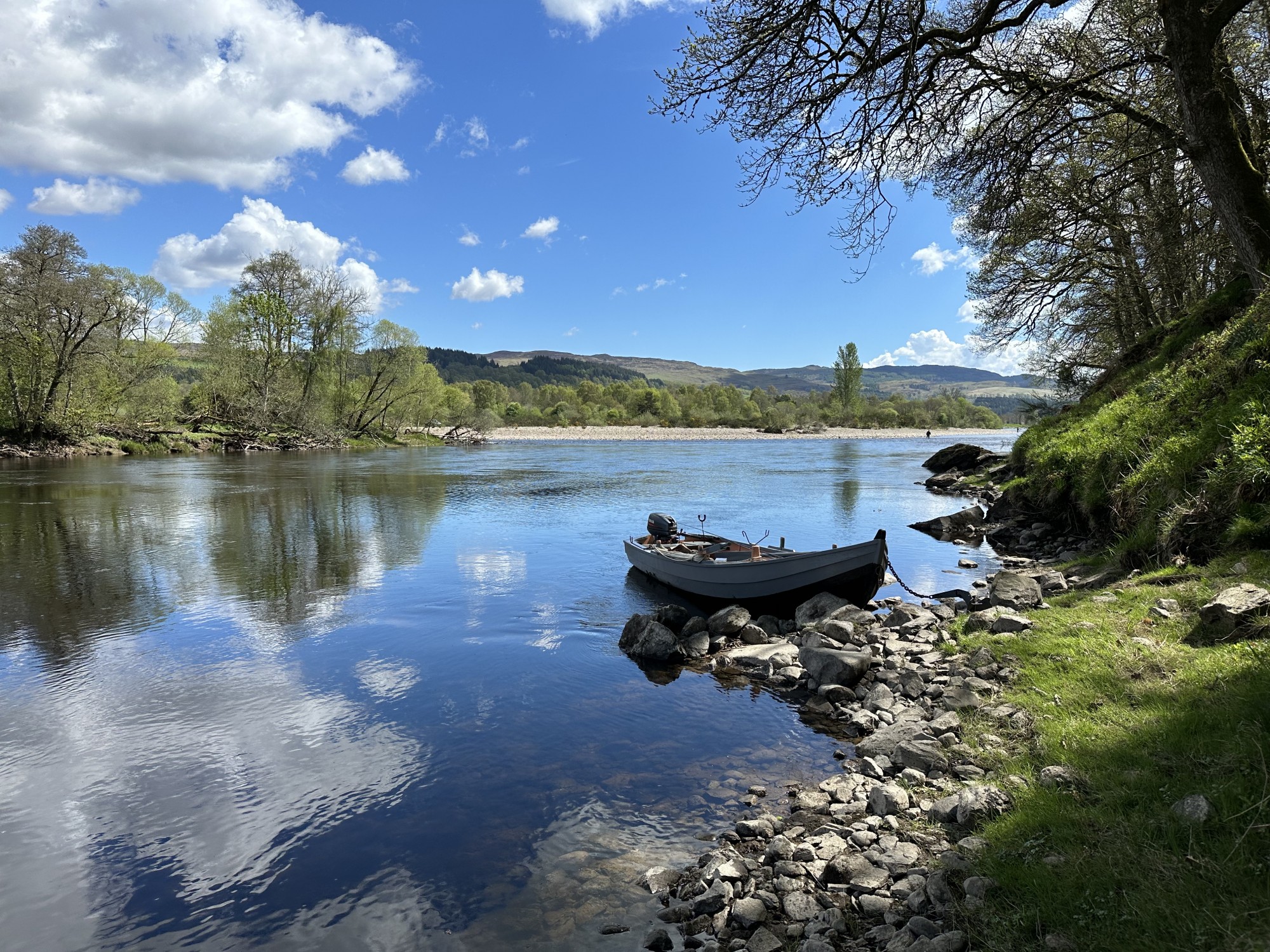 This is the Rock Pool on the River Tay slightly upstream of the River Tay & River Tummel confluence which is just visible in the background. This is a very good salmon fishing area in Scotland and worthy of a salmon fishing trip. I took this beautiful shot in low water conditions during June after commuting down in this traditional Tay salmon boat.