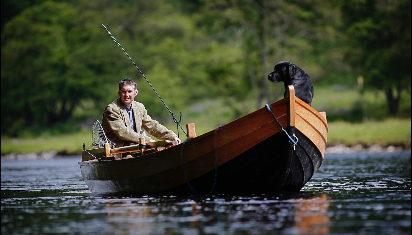 Here's a shot of myself while serving as a professional River Tay salmon fishing guide with my black labrador dog 'Selkie' out in the Cottar Pool of the Newtyle Beat near Dunkeld. This shot was taken by professional Scottish photographer Peter Sandground for the Glasgow Herald Magazine.